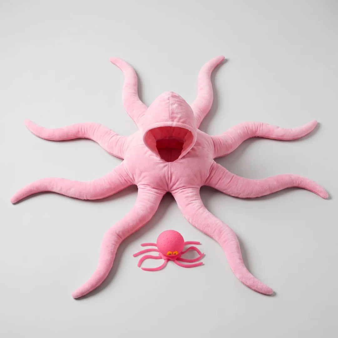 Baby in octopus costume on the floor